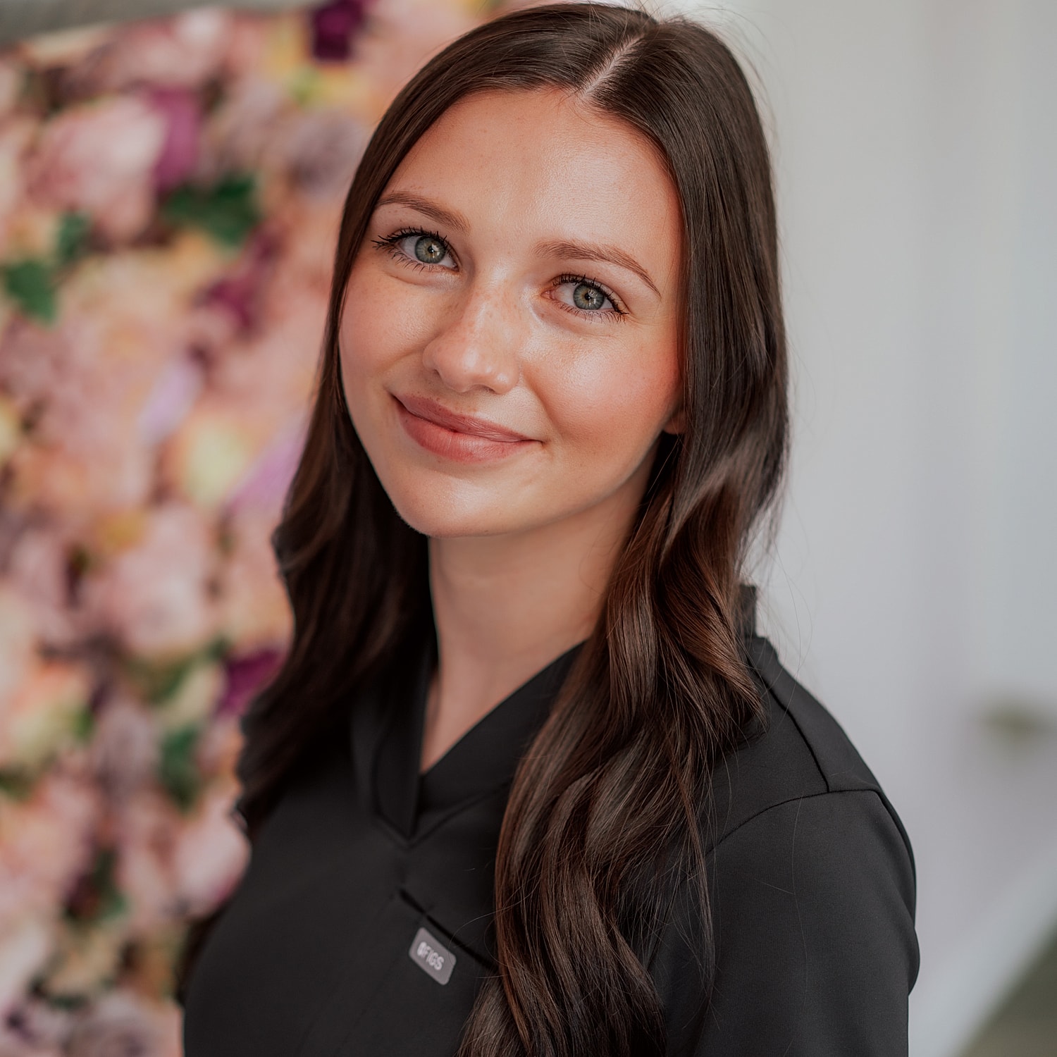 Smiling woman in a professional setting.