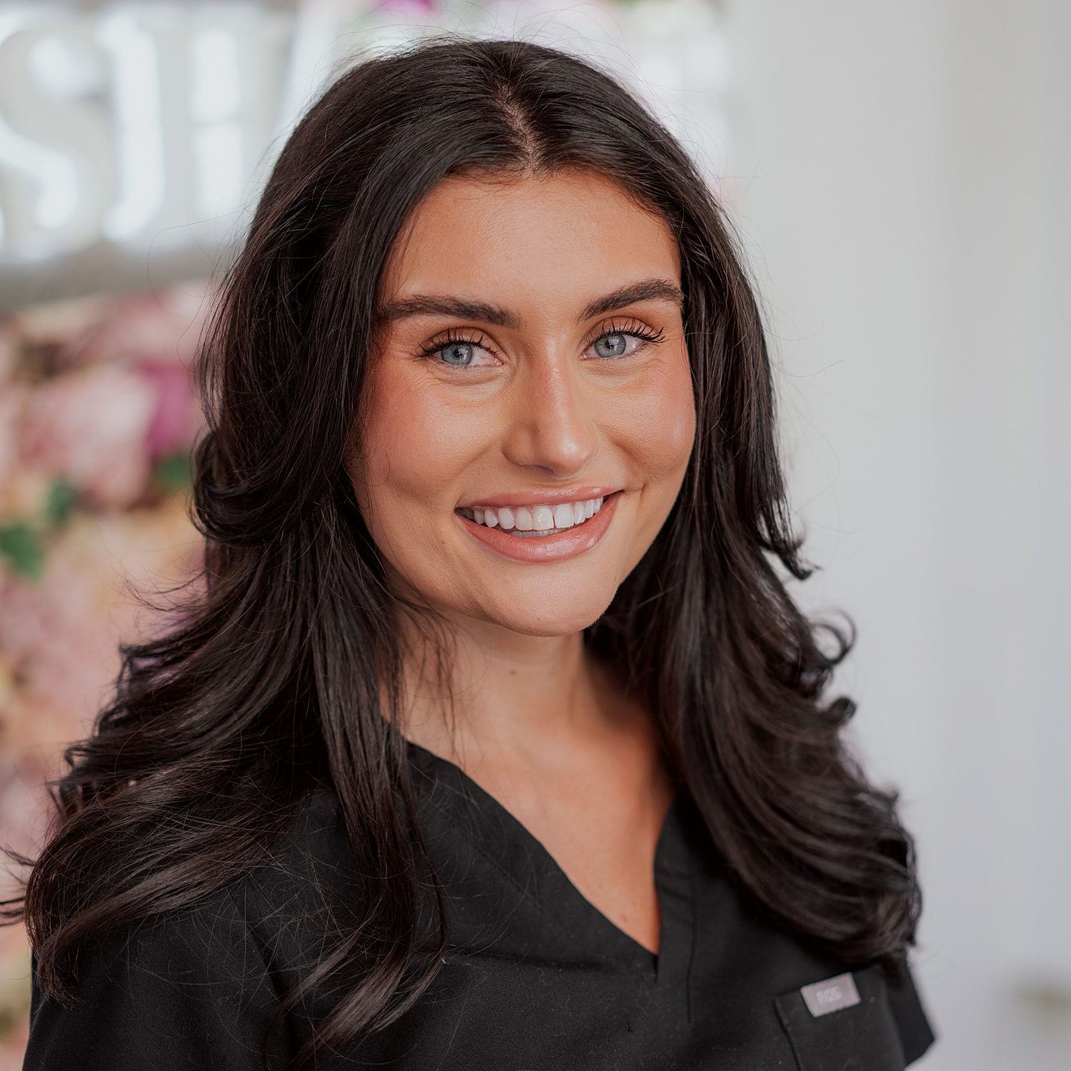 Silhouette of a woman with wavy hair.