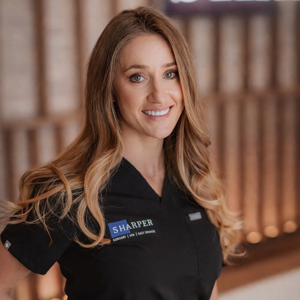 Silhouette of a woman's head and shoulders.