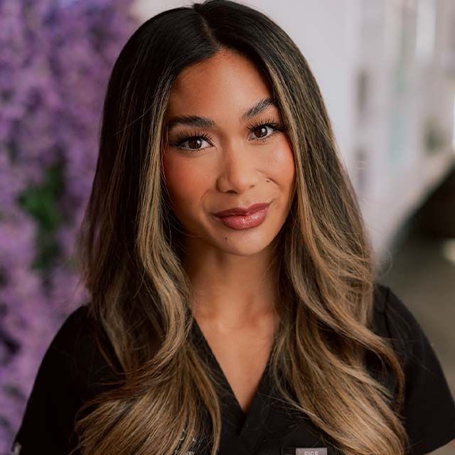 Portrait of a woman with long, flowing hair.