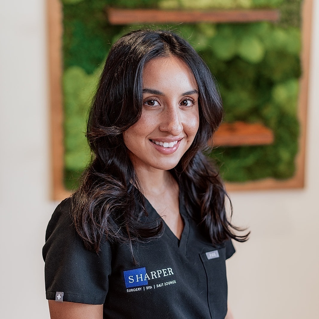 Silhouette of a woman's head and shoulders.