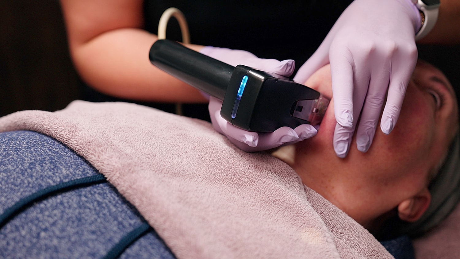 Skincare treatment with a handheld device.