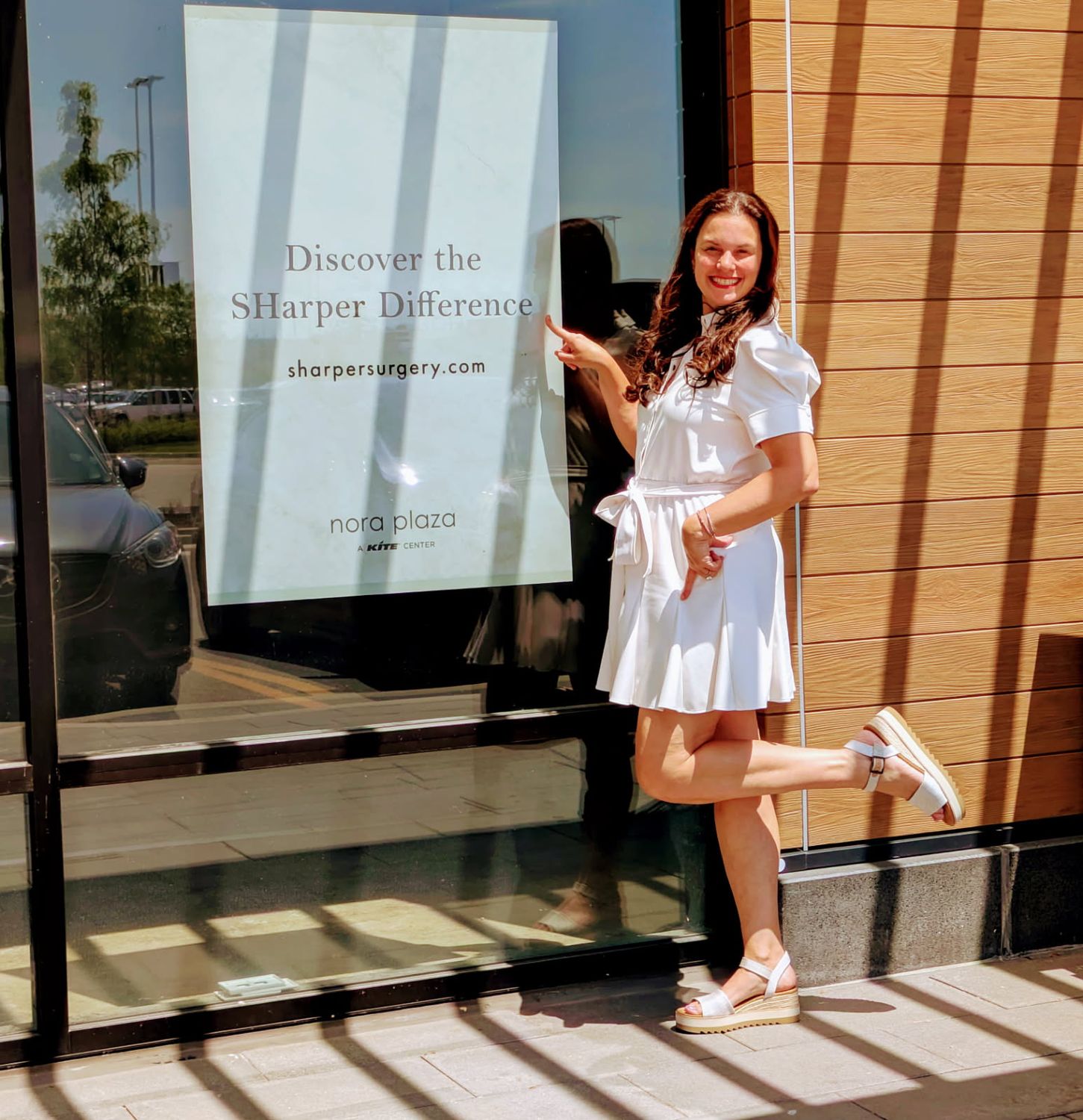 Spa and surgery sign with purple flowers.