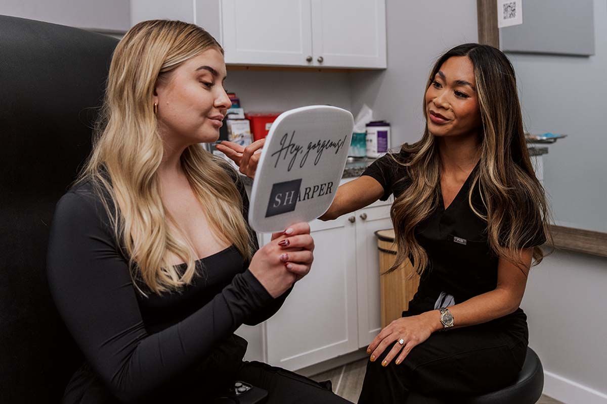 indianapolis botox patient looking in mirror