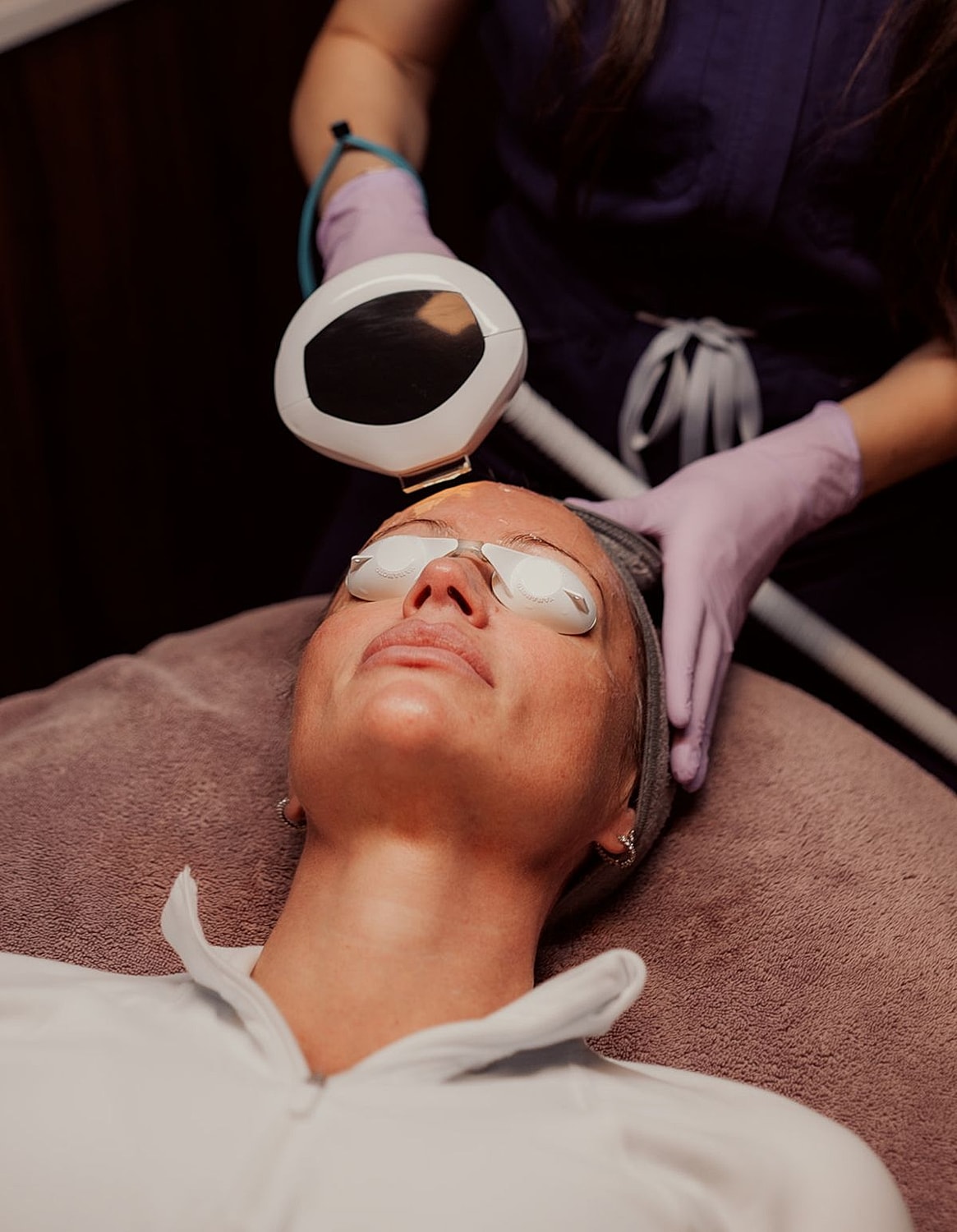 Facial treatment using laser technology in spa.