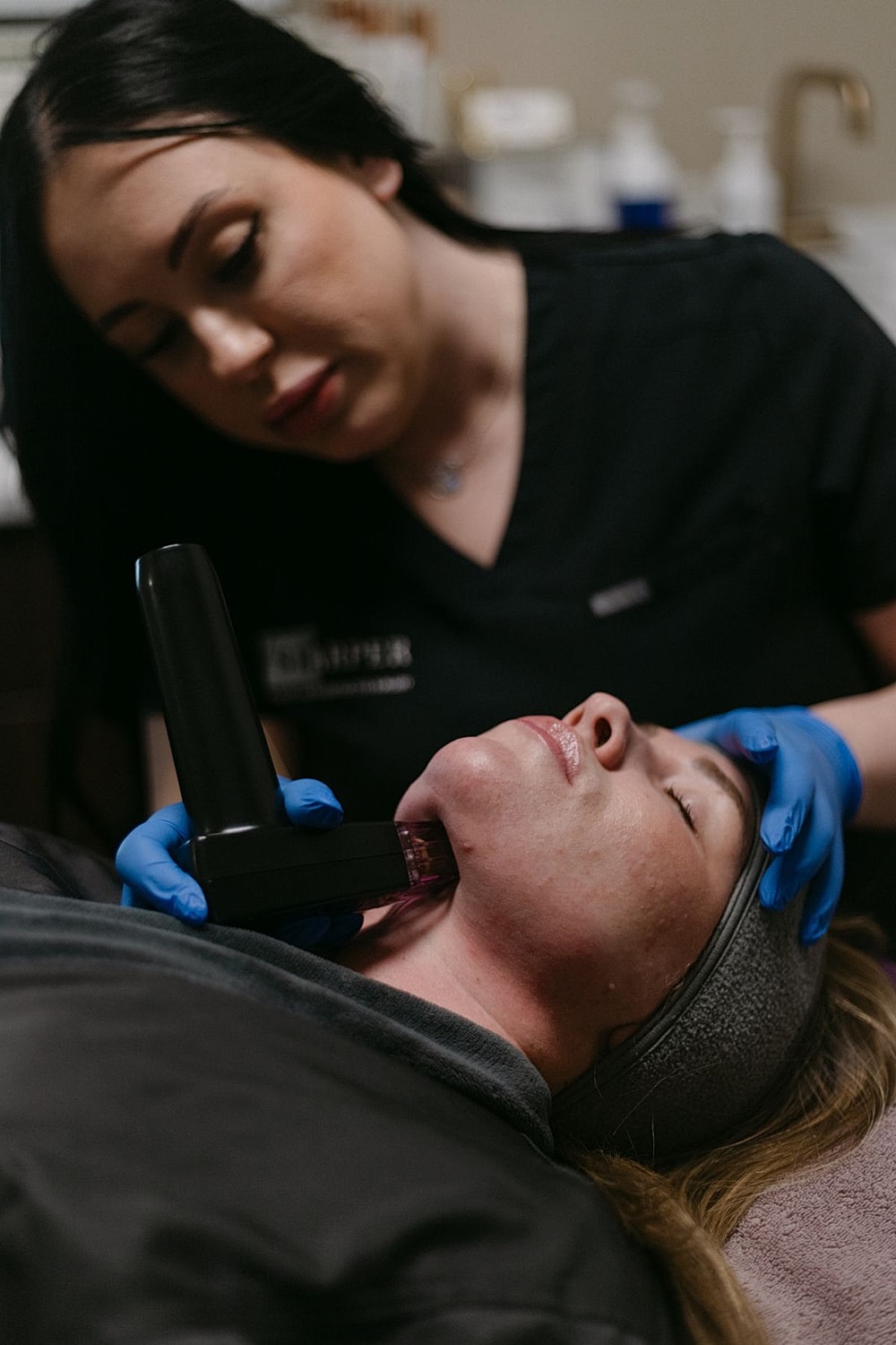 Skincare treatment in progress at a clinic.