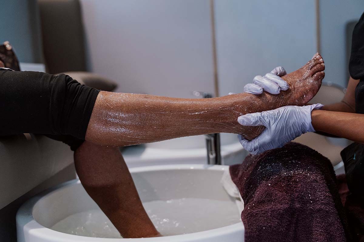 Foot care treatment in a spa setting.