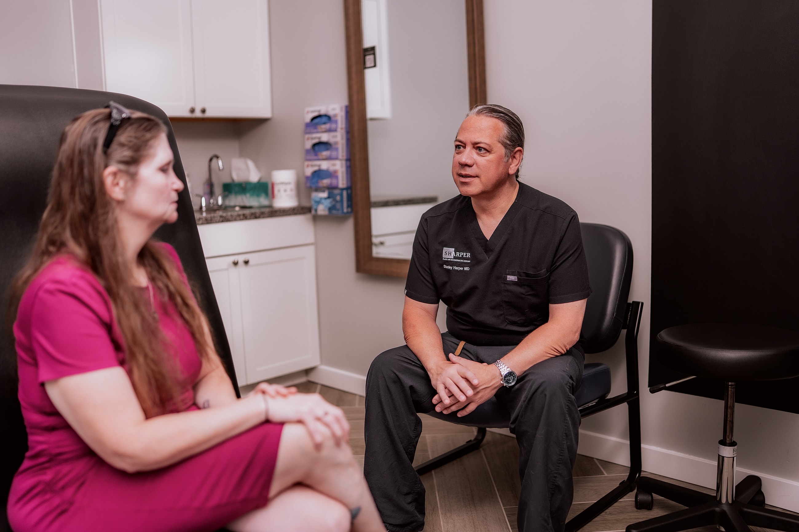 Doctor consulting with patient in medical office.