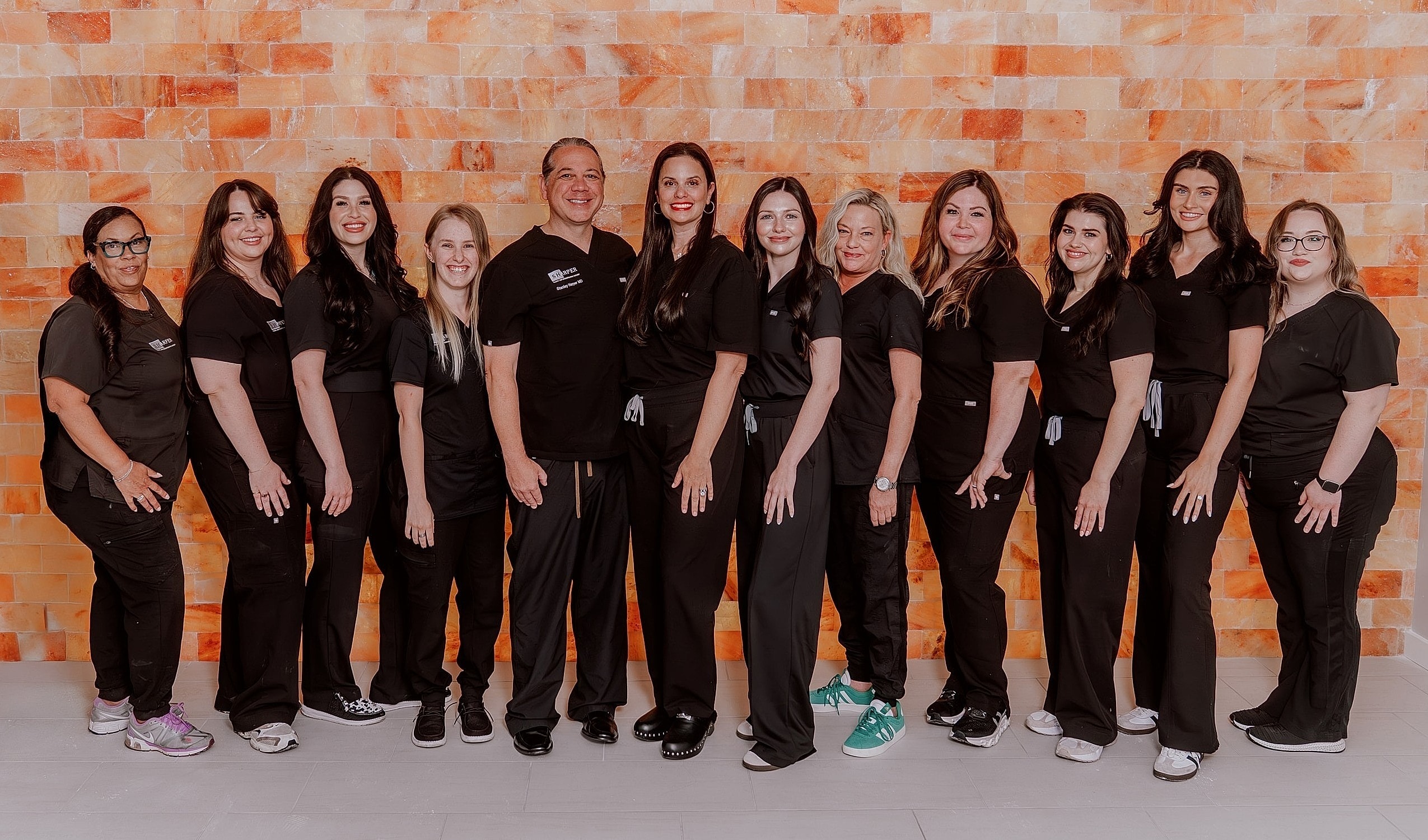 Team of professionals posing together.