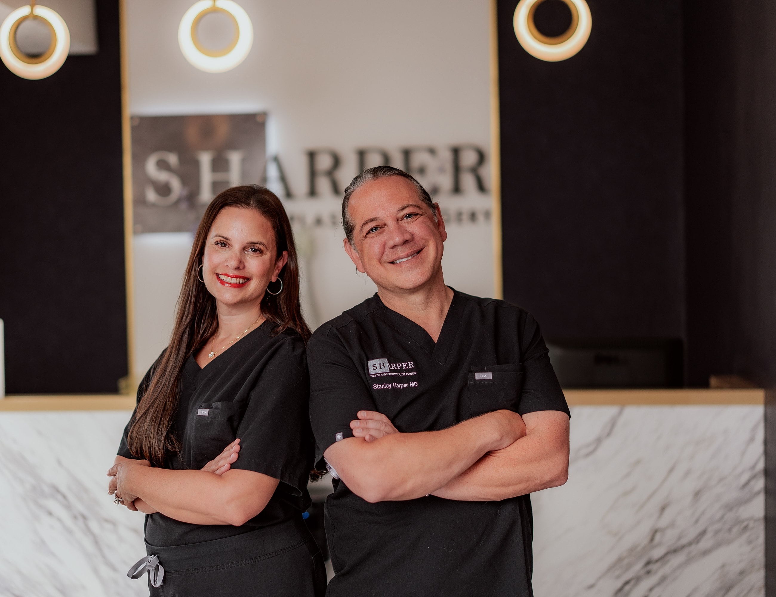Medical professionals posing in a clinic setting.