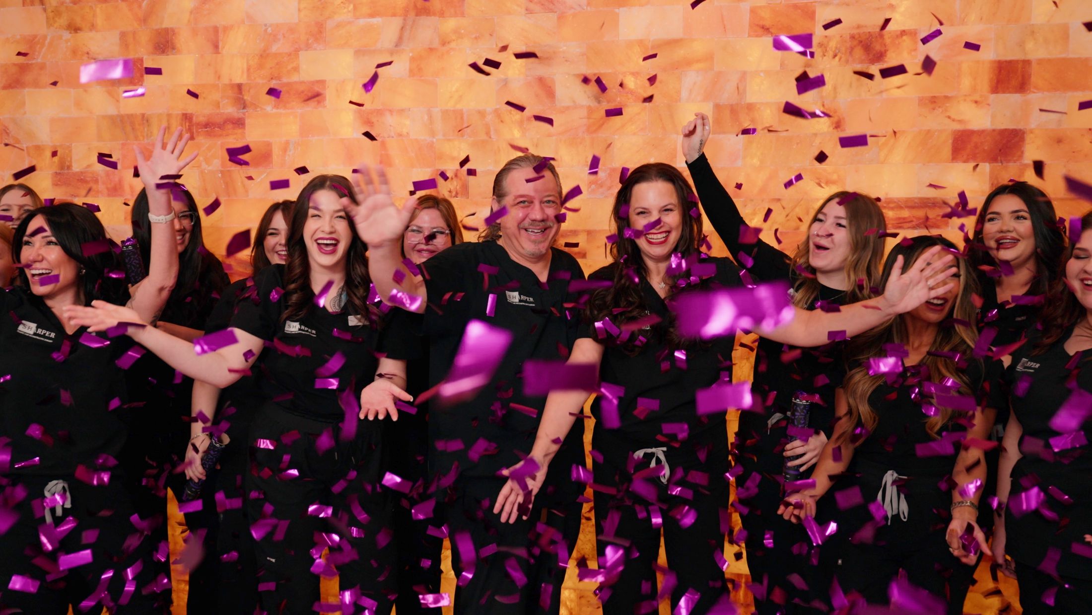 Celebration with confetti and joyful group.