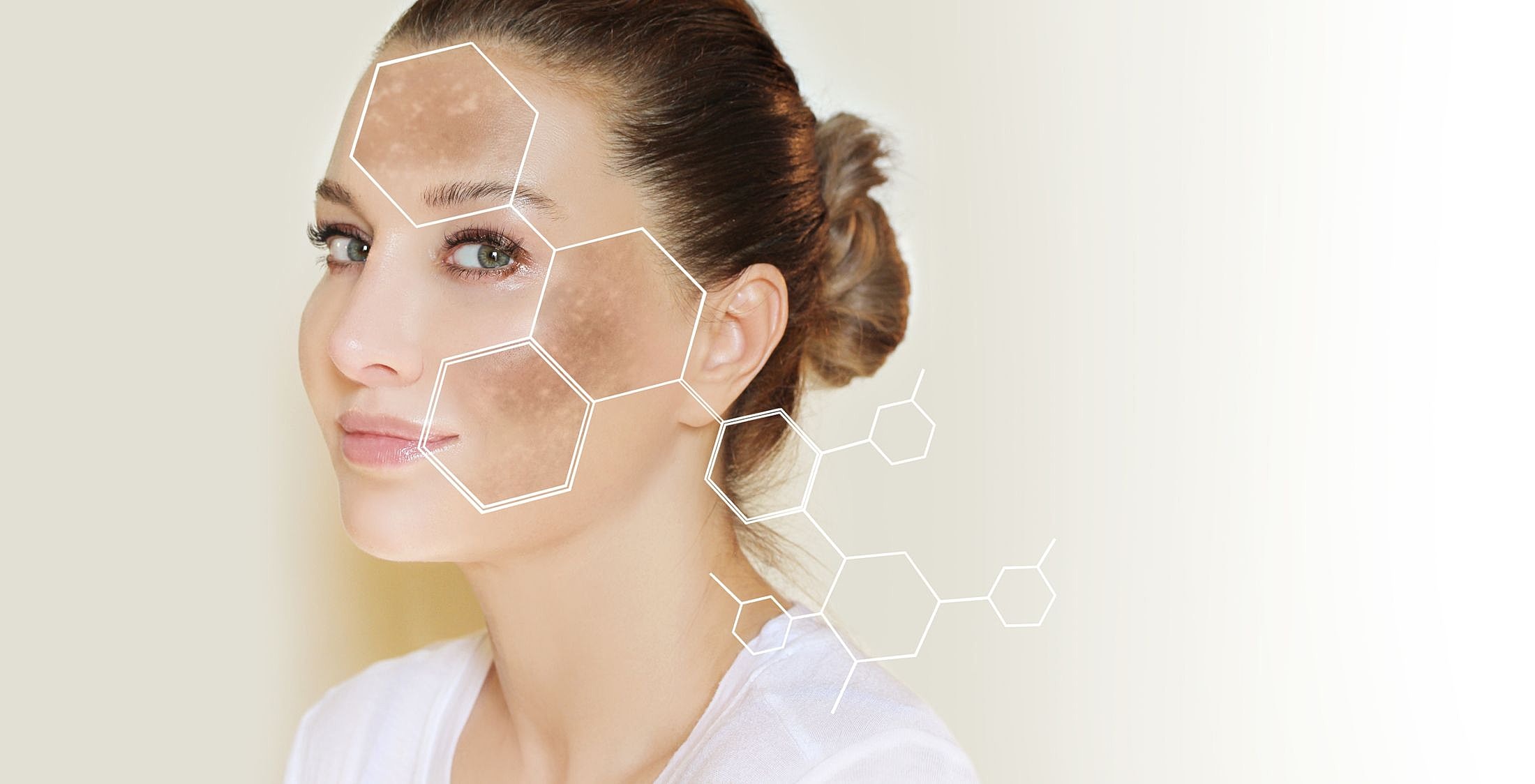 Woman's face with skincare molecule graphics overlayed.