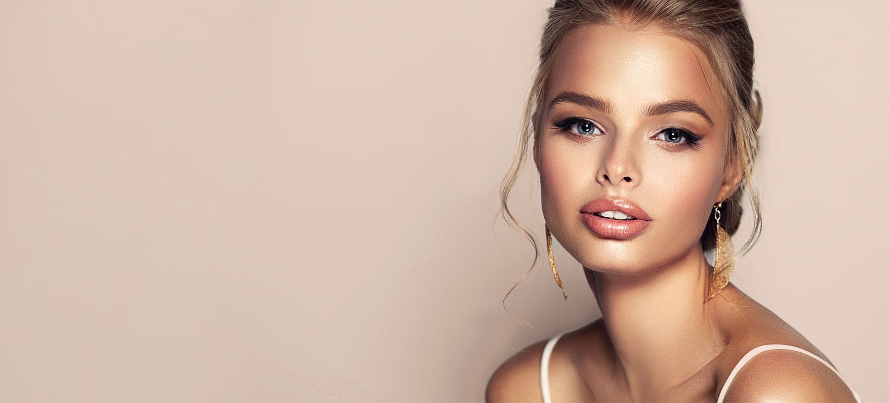 Close-up portrait of a woman with elegant makeup.